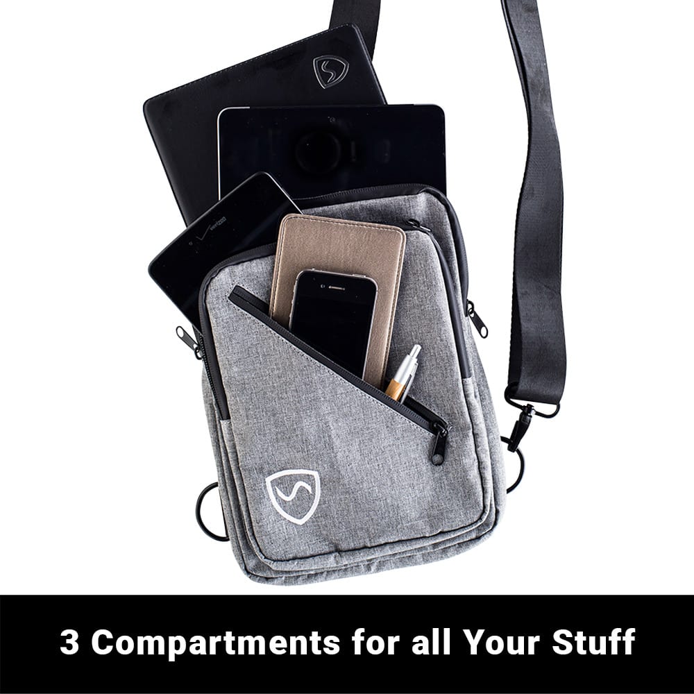 SYB sling bag carrying phone, keys, and wallet